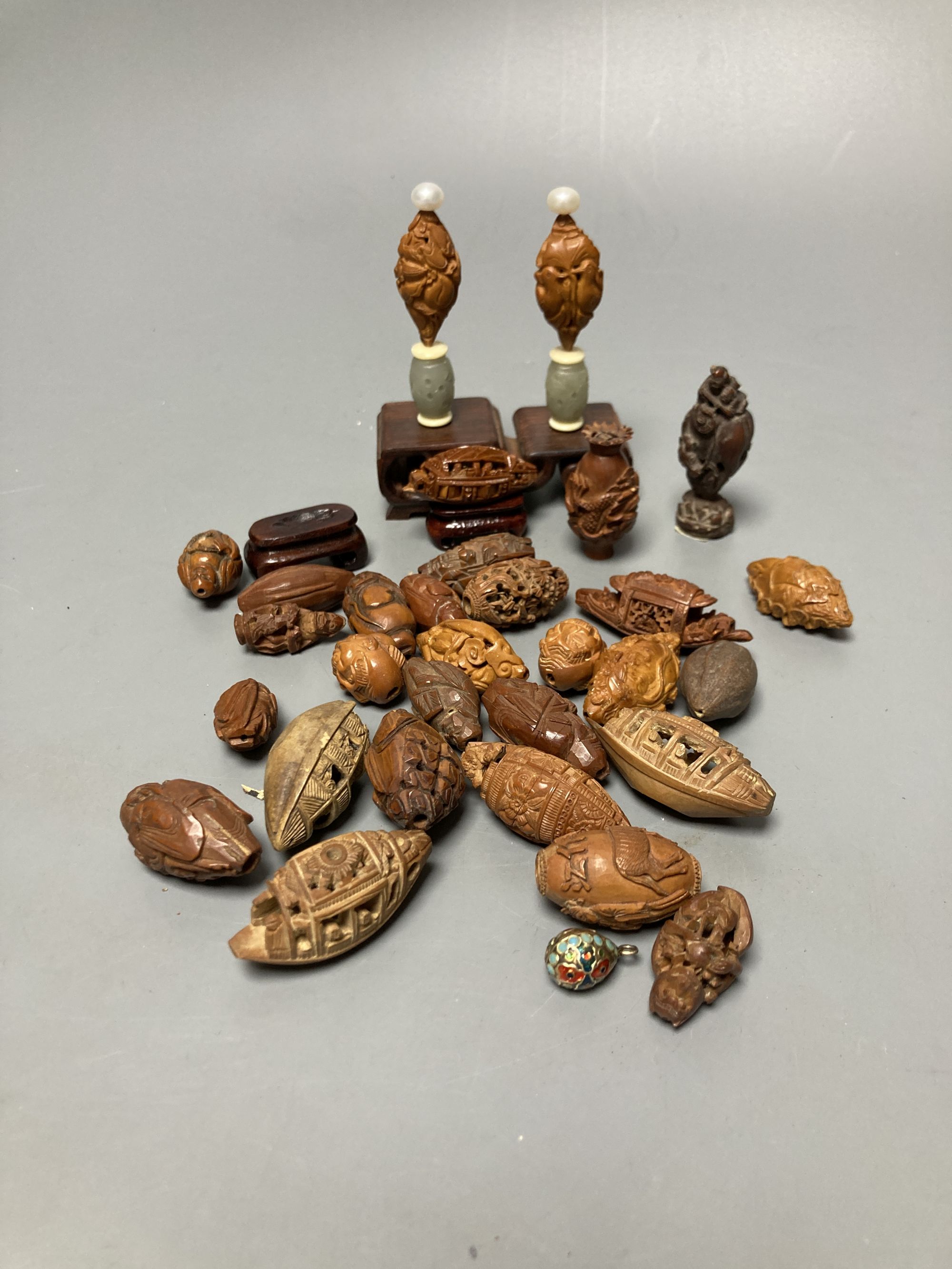 A group of Chinese peach stone carvings